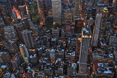 Aerial view of city lit up at night