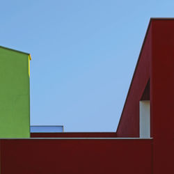 Low angle view of building against clear blue sky