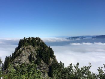 Scenic view of tree mountains against sky