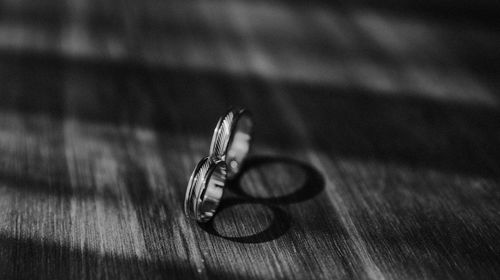 High angle view of wedding rings on table