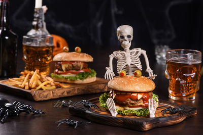 Monster burger on a sitting skeleton will definitely lift your spirits and is the halloween party