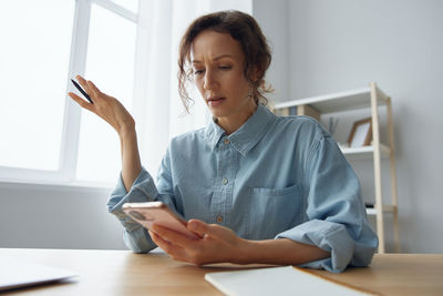 Young woman using mobile phone