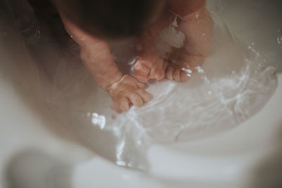 High angle view of baby girl in bathtub