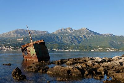 Scenic view of sea against clear blue sky