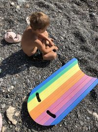 High angle view of boy playing on beach