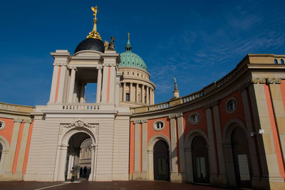 Low angle view of church against blue sky