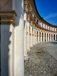 Corridor of historic building against sky