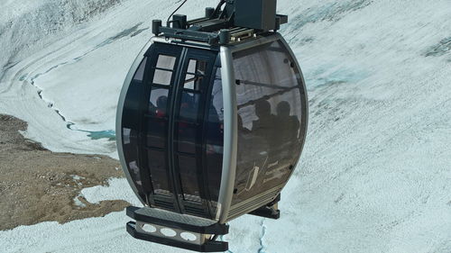 High angle view of wheel by sea during winter