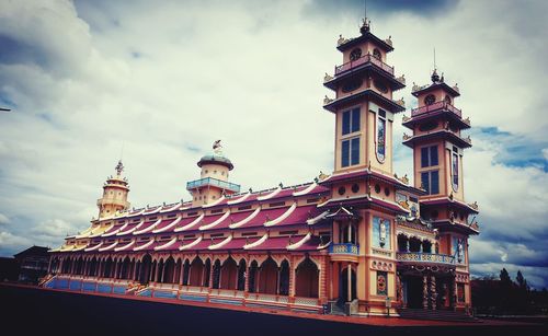 Low angle view of cathedral against cloudy sky