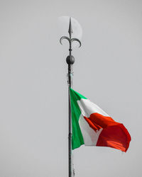 Low angle view of flag against sky