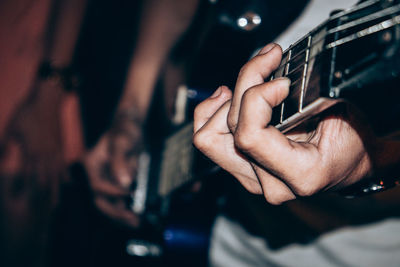 Close-up of man using mobile phone