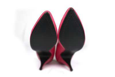 Close-up of fresh red heart shape over white background