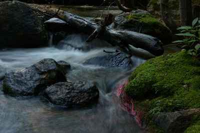 Scenic view of river flowing through rocks