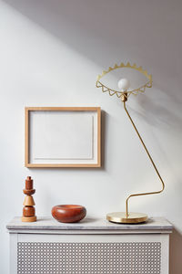 Radiator with marble top, lamp, picture frame and wood objects