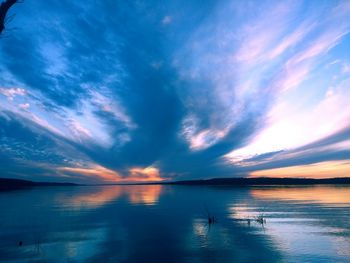 Scenic view of sea against sky at sunset