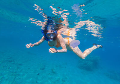 Woman snorkeling in sea