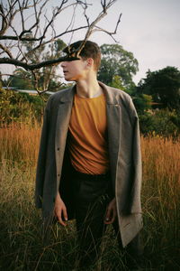 Young man standing on field