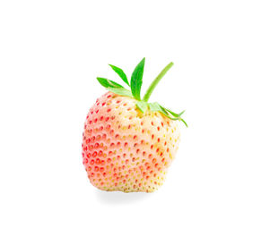 Close-up of strawberry over white background