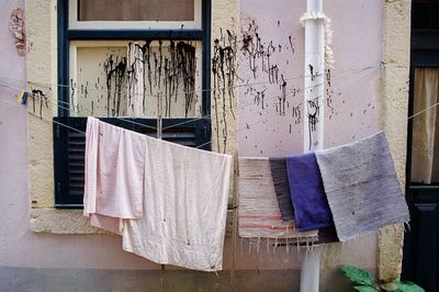 Close-up of clothes drying against building