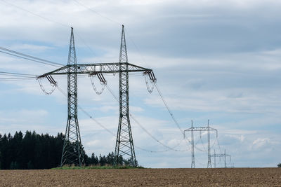 High voltage power lines with blue sky