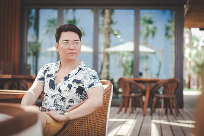 Young man sitting on table