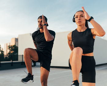 Young woman exercising in gym