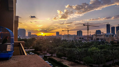 Panoramic view of buildings against sky during sunset