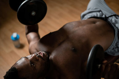 Low section of man exercising at gym