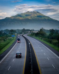 High angle view of road by mountain against sky