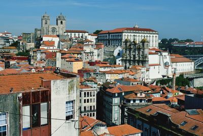 High angle view of buildings in town against sky