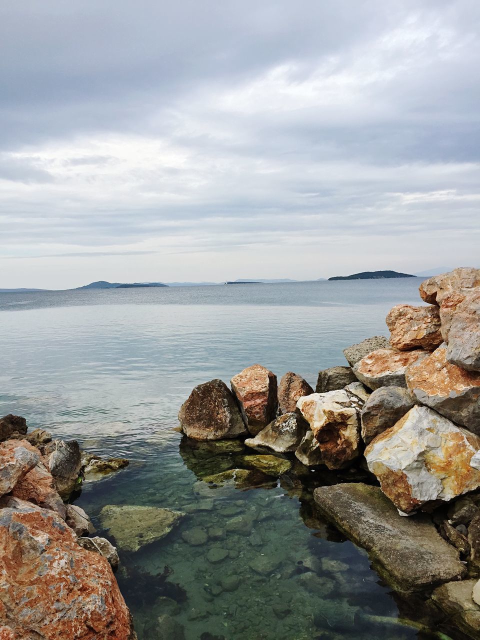 water, sky, sea, rock - object, tranquility, cloud - sky, tranquil scene, scenics, horizon over water, beauty in nature, nature, stone - object, cloudy, cloud, shore, beach, idyllic, rock, stone, calm