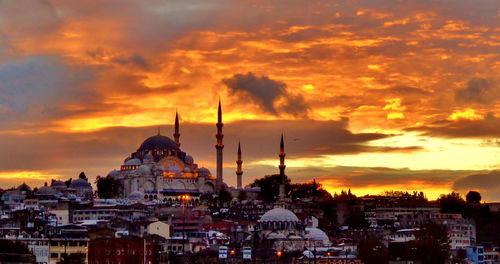 Townscape against sky during sunset
