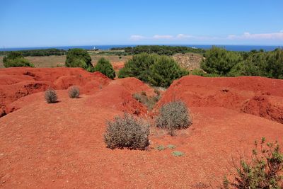 Scenic view of rocks on landscape against sky