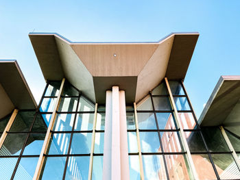 Low angle view of building against clear blue sky