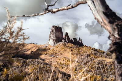 Panoramic view of rocks and mountains against sky