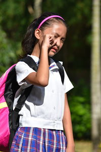 Low section of girl standing outdoors