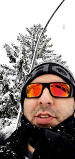 Close-up portrait of woman in snow