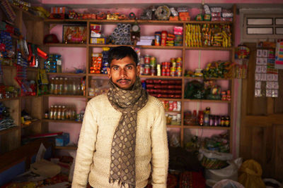 Portrait of man standing in shop