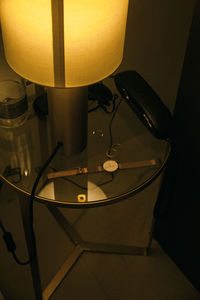 High angle view of illuminated electric lamp on table