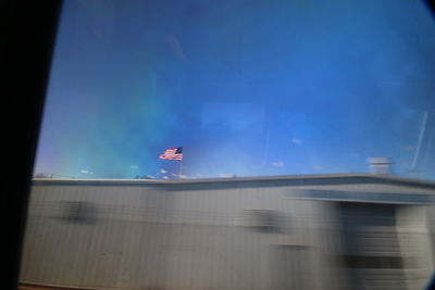 Low angle view of flag against sky