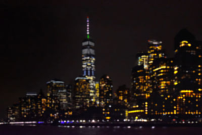 Illuminated buildings against sky at night