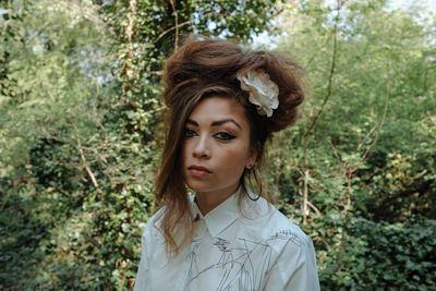 Portrait of fashionable woman in forest