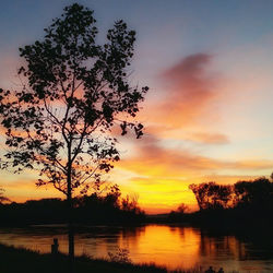 Scenic view of lake at sunset