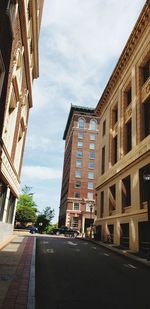 Low angle view of buildings against sky in city