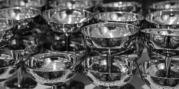 Close-up of wine glasses on table