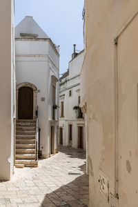 Alley amidst buildings in city