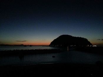 Scenic view of sea against clear sky during sunset