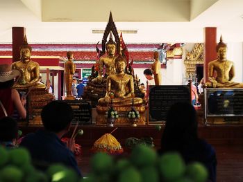 Statue outside temple in building