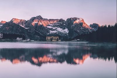 Scenic view of lake and mountains against sky