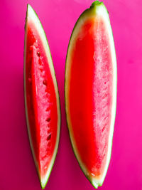 Close-up of apple against pink background
